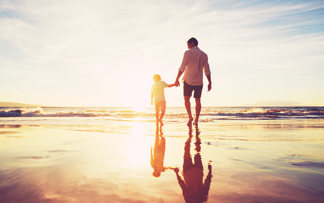 Father and son walking together in celebration of Father's Day.